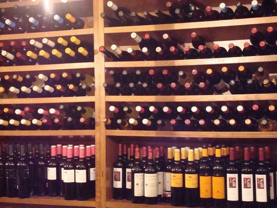 Wine bottles arranged in a cellar rack